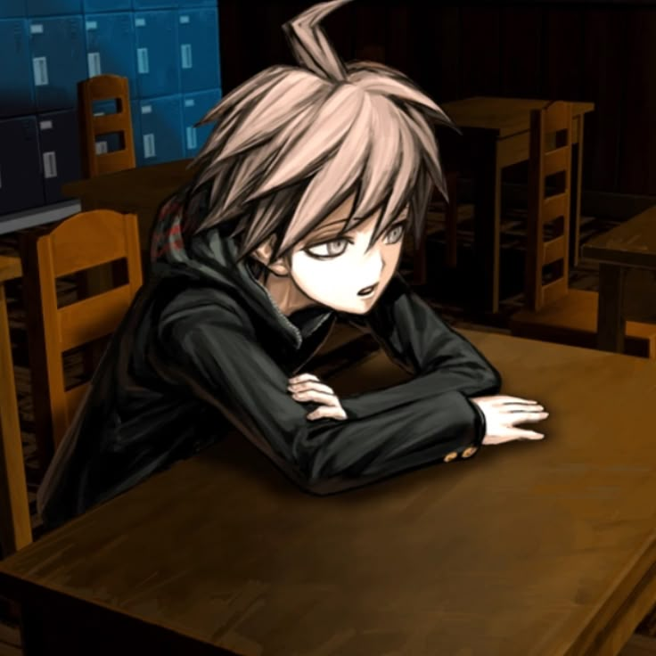 an anime character sitting at a table with his arms crossed and eyes closed, in front of him