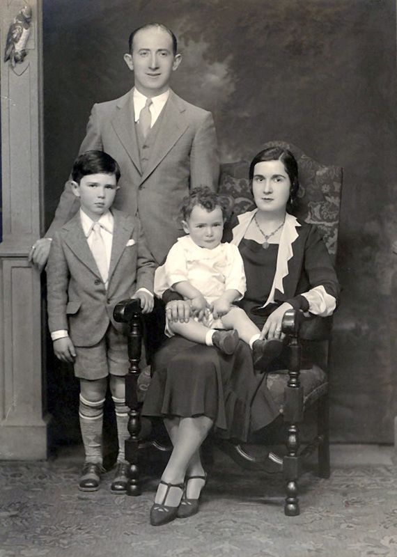 an old black and white photo of a family