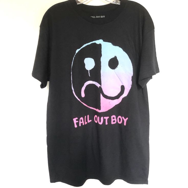 Fall Out Boy Black Band T Shirt Fall Out Boy Band T-Shirt Featuring A Front Smiley Face Graphic Soft Cotton Cut In A Relaxed Fit With Short Sleeves Crew Neck. - 100% Cotton, - New - Large - Chest: 22” - Length 31” Fall Out Boy Black T Shirt Emo Black T-shirt With Graphic Design, Black Graphic T-shirt For Fall, Black Logo Print T-shirt For Fall, Black Emo T-shirt For Fall, Black Emo T-shirt For Summer, Emo Short Sleeve T-shirt With Text Print, Emo Style Short Sleeve T-shirt With Text Print, Emo Style Fall T-shirt For Streetwear, Black Graphic Design T-shirt For Fall