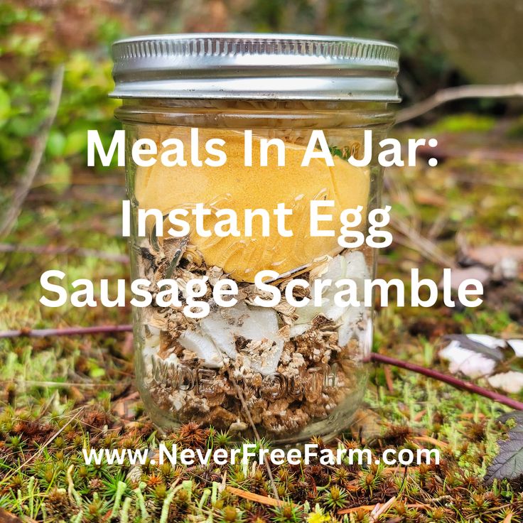 a jar filled with food sitting on the ground next to some leaves and grass in front of