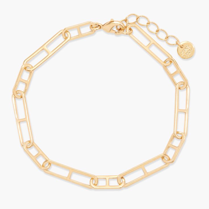 Experience effortless luxury with the Finnley Bracelet. Crafted from lustrous gold and boasting an elongated mariner link chain, this exquisite piece of jewelry will add a touch of timeless glamour to any look. Dare to be bold and make a statement with the Finnley Bracelet. Why not treat yourself to a little bit of elegance? Available in 14k gold plated brass 6 1/2" elongated mariner link chain with 1" extender Lobster claw closure SKU: BYB1198 Gold-tone Paperclip Bracelet With Rectangular Links, Metal Chain Bracelet With Rectangular Links, Timeless Oval Link Gold Bracelet, Timeless Gold-tone Bracelet With Rectangular Links, Timeless Gold Bracelet With Chunky Chain, Modern Gold Chain Bracelet With Hook And Links, Timeless Gold Chunky Chain Bracelet, Gold Bracelet With Rectangular Links, Classic Gold Bracelets With Hooks And Links