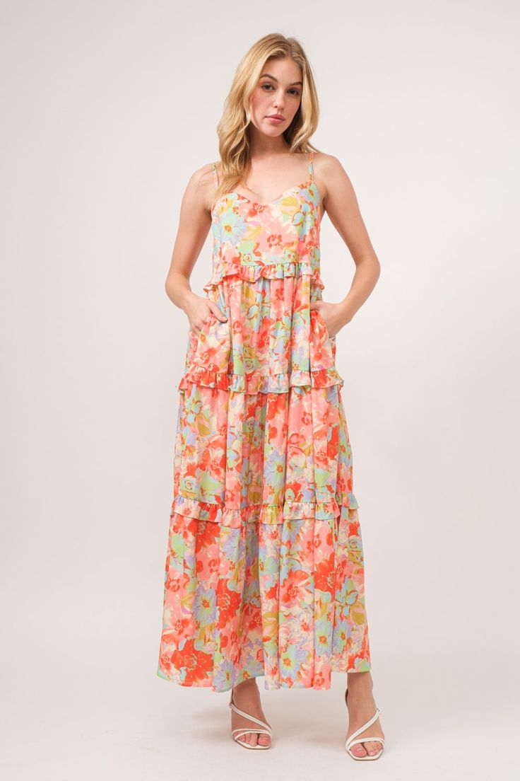 The floral ruffled tiered maxi cami dress is a stunning and feminine choice for any special occasion. With its floral print and tiered design, this dress exudes elegance and romance. The ruffled tiers add movement and depth to the dress, creating a whimsical and ethereal look. Perfect for weddings, parties, or summer outings, this dress is both beautiful and versatile. Embrace your romantic side and shine in the floral ruffled tiered maxi cami dress for a captivating and elegant ensemble. Elevat Floral Print Tiered Sundress, Flowy Floral Print Tiered Dress For Garden Party, Floral Print Tiered Dress For Garden Party, Tiered Floral Dress For Vacation, Spring Tiered Dress For Garden Party, Spring Garden Party Tiered Midi Dress, Summer Tiered Maxi Dress With Floral Print, Tiered Floral Print Maxi Dress For Summer, Vacation Floral Tiered Skirt Dress With Ruffles