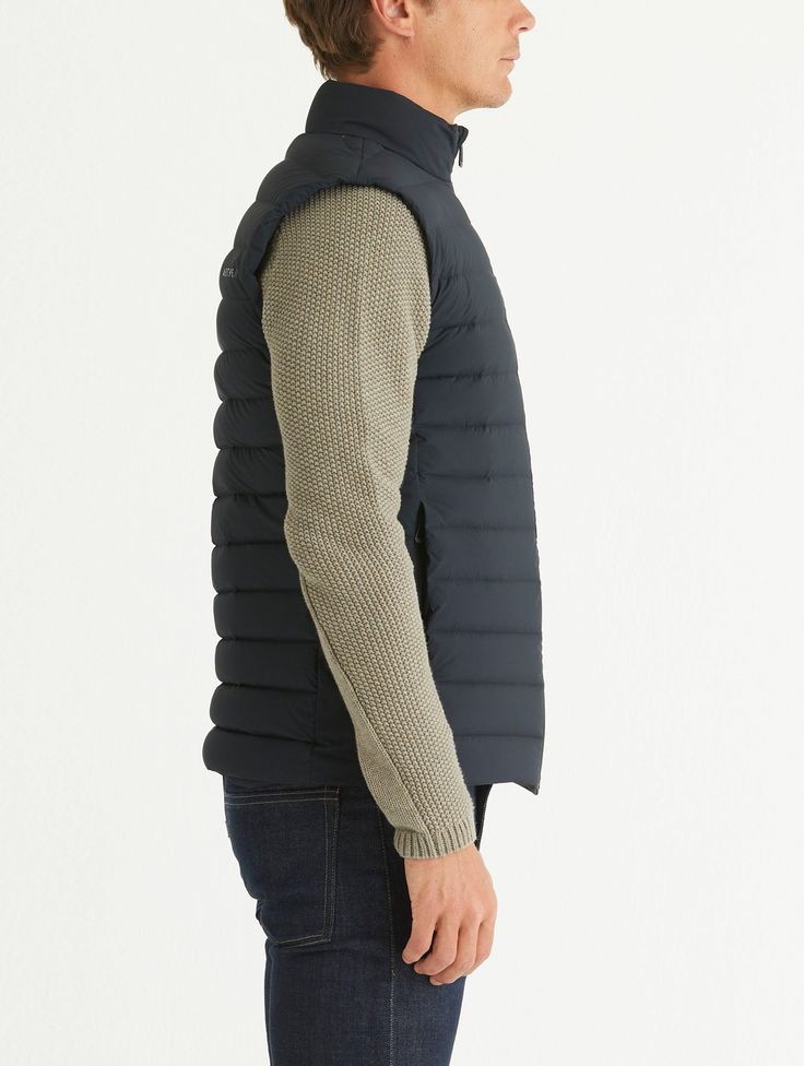 Drawing on the popularity of our Launch Collection, we developed the Launch Vest. Constructed from a pre-baffled stretch ripstop, the lightweight Launch Vest is an ideal piece for transitional weather, perfect for layering under a shell. Please note: This vest is slim-fitting. Black Windproof Functional Vest, Moisture-wicking Black Tank Vest, Quilted Black Nylon Vest, Luxury Black Nylon Vest, Black Moisture-wicking Vest For Sports, Onyx, Layering, Product Launch, Slim Fit