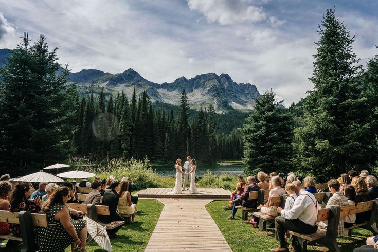 a bride and groom standing at the end of their wedding ceremony