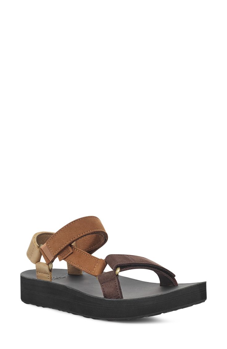 An edgy mash-up of the brand's Original Universal and Flatform Universal sandals, this leather version delivers sporty style with an upgraded look. 1 1/4" heel; 1" platform; 1/4" slope (size 9) Adjustable straps with hook-and-loop closures EVA foam-cushioned footbed Leather upper and lining/rubber sole Imported Trendy Everyday Leather Sandals, Leather Platform Sport Sandals, Sporty Leather Platform Sport Sandals, Brown Synthetic Sport Sandals With Buckle Closure, Brown Synthetic Sport Sandals With Buckle, Brown Leather Sport Sandals With Round Toe, Everyday Leather Platform Sandals, Trendy Leather Sport Sandals With Round Toe, Sporty Leather Platform Sandals