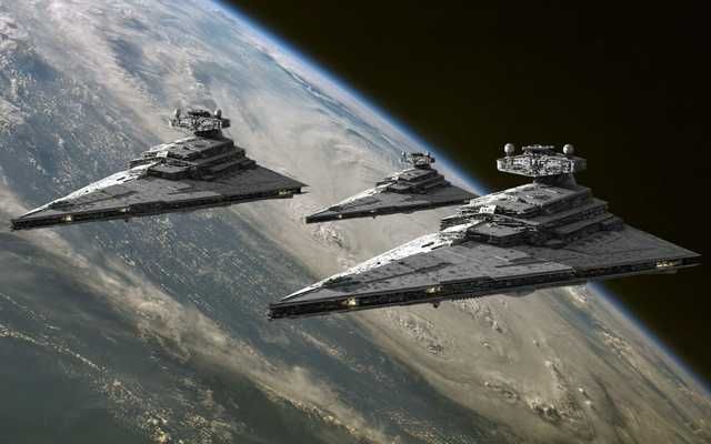 three star wars ships flying over the earth