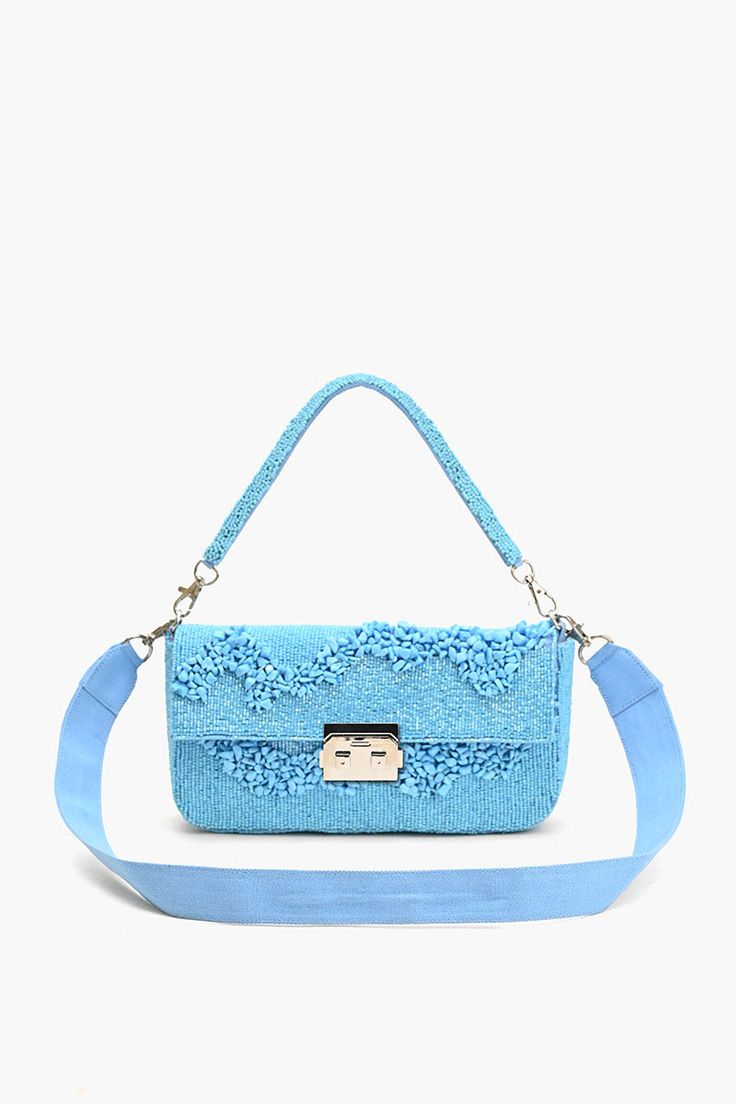 Embellished Design: Fully adorned and embroidered. Dual Handles: Top beaded handle and detachable shoulder strap. Secure Closure: Padlock mini clasp. Functional Interior: Lined with a zip pocket. Dimensions: 10" x 5" x 2"; Belt: 40" x 1.25" Make a statement in style with our latest masterpiece: the Azure Blue Skyline Shoulder Bag. Elevate your ensemble effortlessly with this stylish accessory, marrying practicality with panache. Crafted with meticulous attention to detail and fashioned from prem Blue Beard, Blue Skyline, Functional Interior, Leopard Bag, Monochrome Outfit, Azure Blue, Small Pouches, Beach Tote Bags, Bag Dress