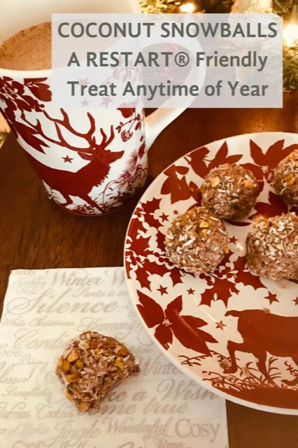 a plate that has some food on it next to a cup and saucer with christmas decorations