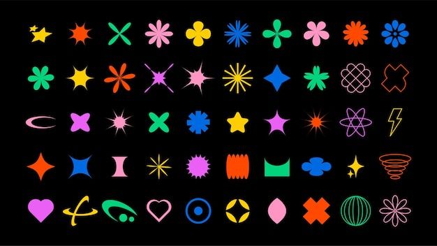 an assortment of different shapes and sizes on a black background with stars, hearts, flowers, and more