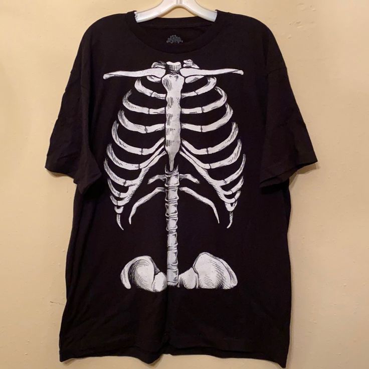 New Condition, Never Been Worn Glow In The Dark Skeleton Torso T-Shirt. 100% Pre-Shrunk Cotton Measurements: Top Shoulder Seam To Top Shoulder Seam 21” Armpit To Armpit 24” Top Of Shoulder To Bottom Front 30” Glow In The Dark Short Sleeve Streetwear T-shirt, Short Sleeve Glow In The Dark T-shirt For Streetwear, Black Graphic Tee With Glow In The Dark Details, Black Short Sleeve Glow In The Dark T-shirt, Casual Glow In The Dark Crew Neck T-shirt, Glow In The Dark Graphic Tee With Short Sleeve, Glow In The Dark Short Sleeve Graphic Tee, Black Glow In The Dark Crew Neck Top, Glow In The Dark Graphic Tee With Crew Neck