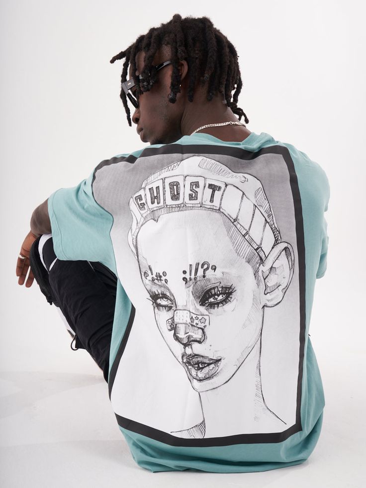 The back of a man wearing a GHOST T-SHIRT with a drawing of a woman. Light Blue Graphic Print T-shirt, Cool Short Sleeve T-shirt With Graphic Print, Light Blue Graphic T-shirt For Streetwear, Hip Hop Crew Neck Top With Screen Print, Light Blue Graphic Print T-shirt With Relaxed Fit, Light Blue Cotton T-shirt With Graphic Print, Light Blue Screen Print T-shirt For Streetwear, Hip Hop Crew Neck Top With Front Print, Blue Screen Print T-shirt For Streetwear