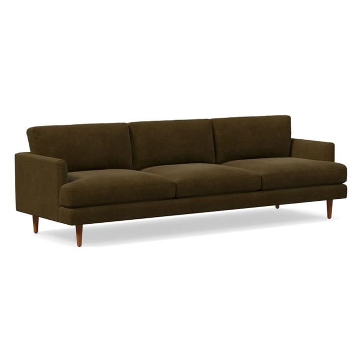 a brown couch sitting on top of a white floor