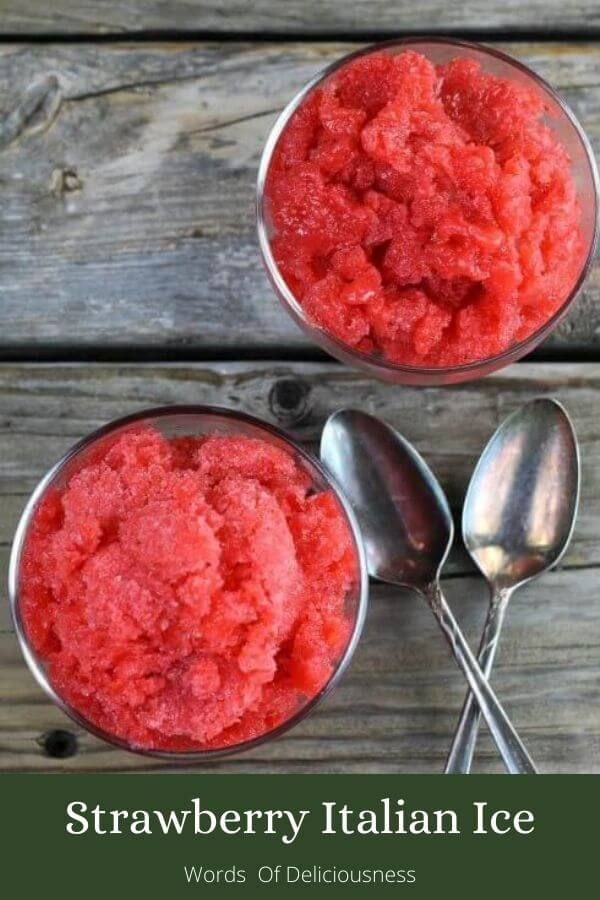 two bowls filled with strawberry italian ice cream next to spoons and forks on a wooden table