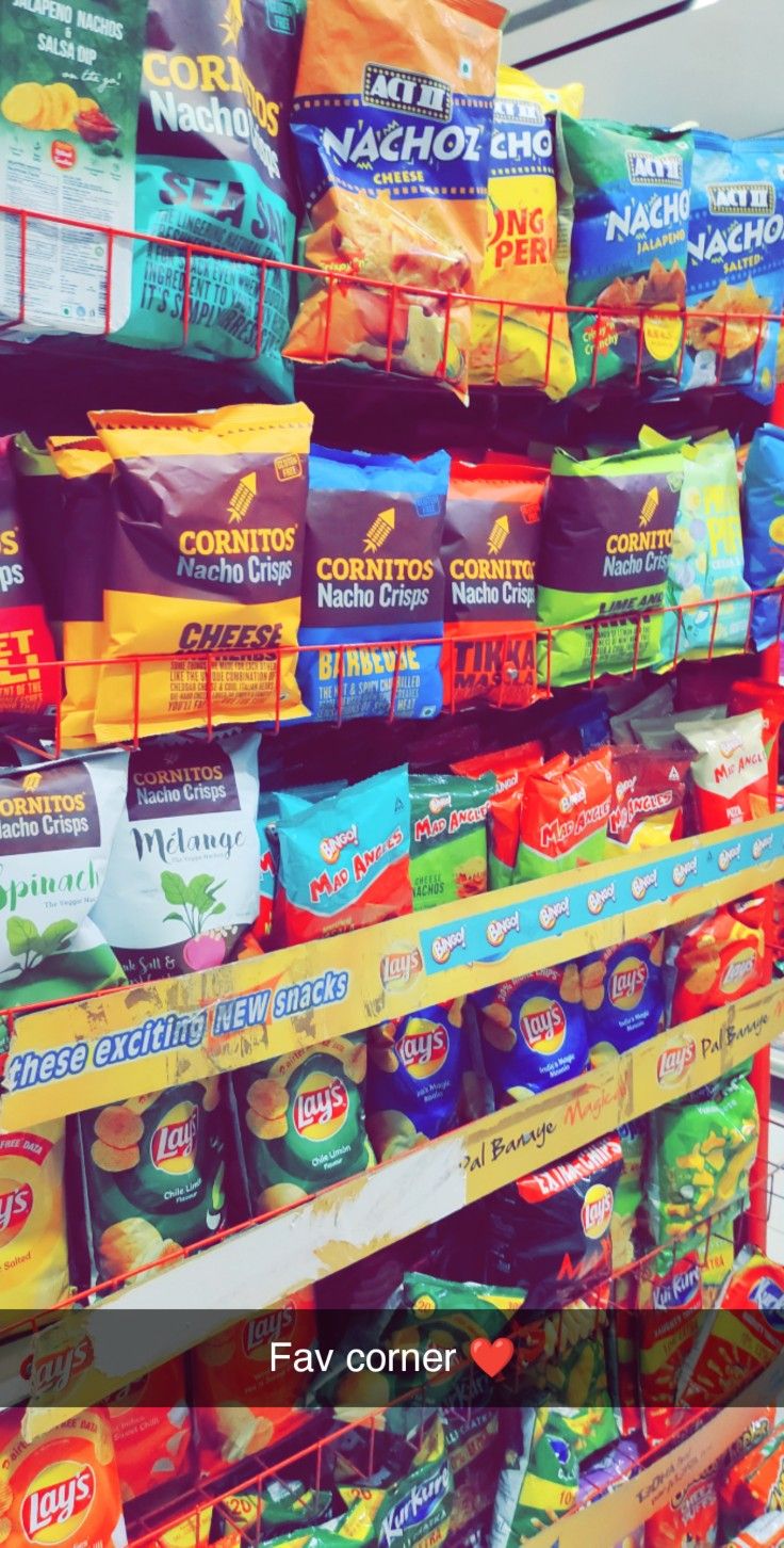 a display in a grocery store filled with lots of different types of chips and condiments