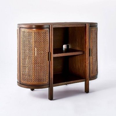 a wooden cabinet with two shelves on one side and an open shelf on the other