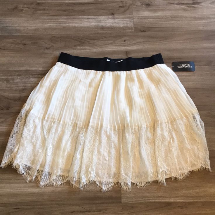 Forever 21 Cream Colored Short Skirt Black Waistband And Lace Detail On Bottom. Forever 21 Tiered Skirt With Lining, Forever 21 Tiered Lined Skirt, Forever 21 White Flowy Skirt, Forever 21 White Tiered Mini Skirt, Forever 21 Flowy Tiered Skirt, Forever 21 Tiered Skirt For Spring, Forever 21 Stretch Mini Skirt For Spring, Forever 21 Tiered Skirt, Forever 21 Stretch Skirt For Spring