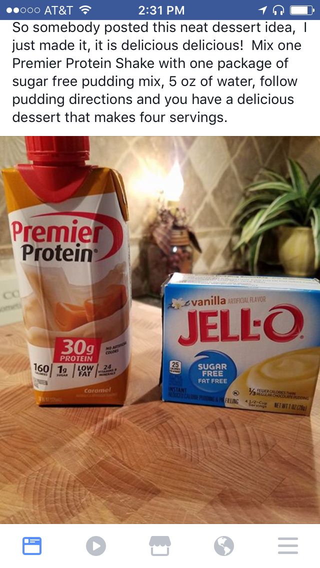 a bottle of jello sitting on top of a wooden table