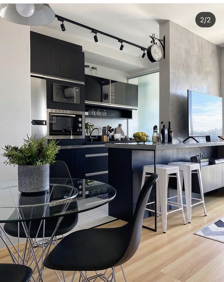 the kitchen is clean and ready to be used as a dining room or living room