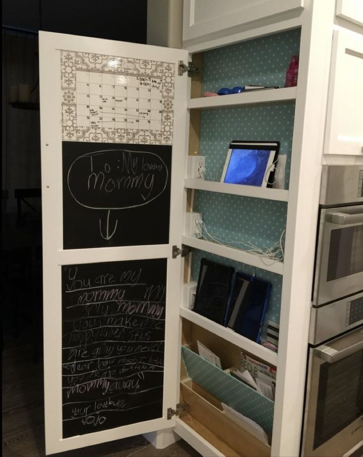 an open refrigerator with writing on the door