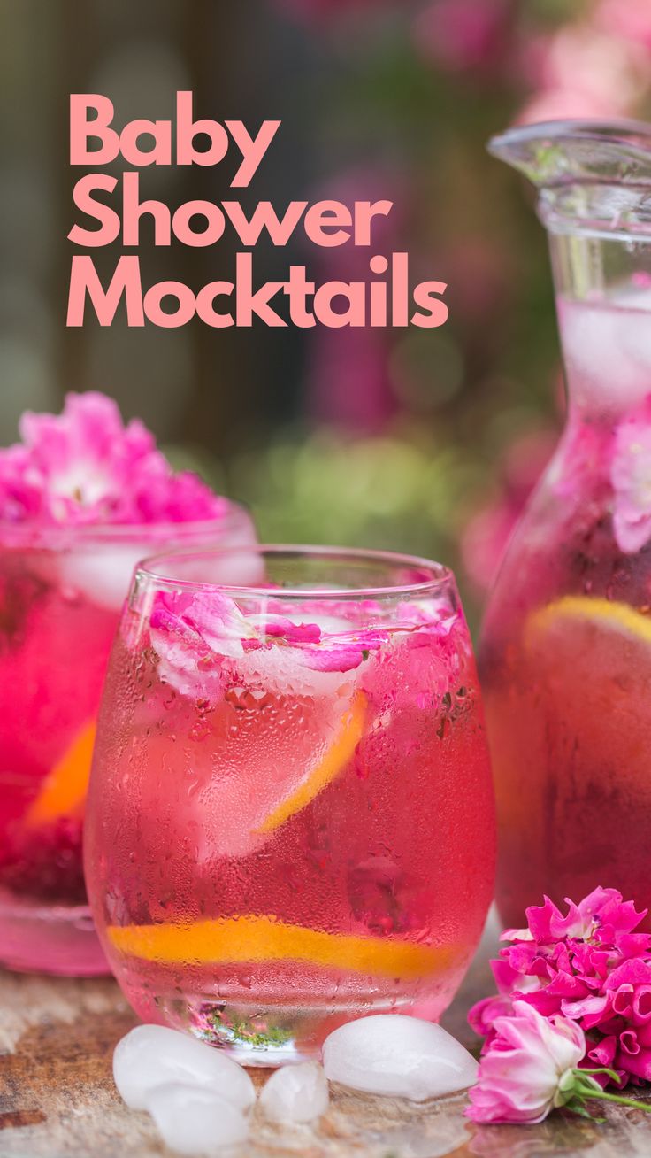 baby shower mocke cocktails with pink flowers and ice in the pitcher, on a table