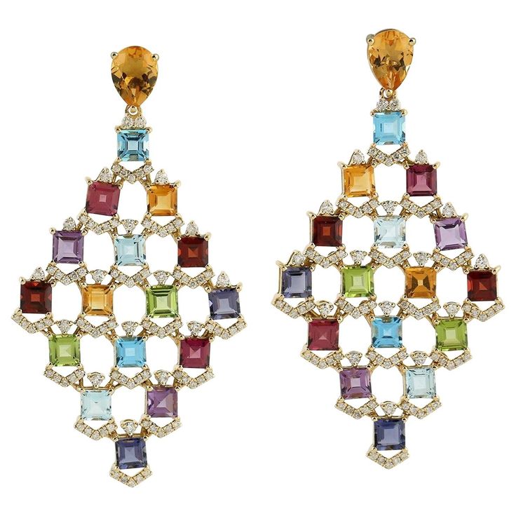 These multi gemstone earrings are handmade in 18 Karat gold. It is beautifully detailed with 19.95 carats amethyst, citrine, garnet, peridot, topaz and 1.39 carats of sparkling diamonds. FOLLOW MEGHNA JEWELS storefront to view the latest collection & exclusive pieces. Meghna Jewels is proudly rated as a Top Seller on 1stDibs with 5 star customer reviews. All items manufactured by us are handmade and can be customized or redesigned. Composition Size-57X30 MM Total Weight-22.81 Gold Weight(Gms)-19 Diamond Dangle Earrings, Art Deco Diamond, Blake Lively, Sparkle Diamonds, Diamond Gemstone, Chandelier Earrings, Gemstone Earrings, Earrings Handmade, Citrine