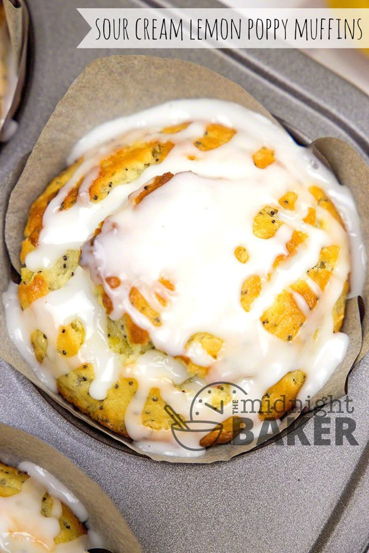 a muffin in a muffin tin with white icing