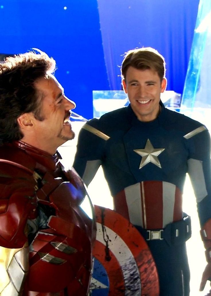 two men dressed as captain america and the avengers