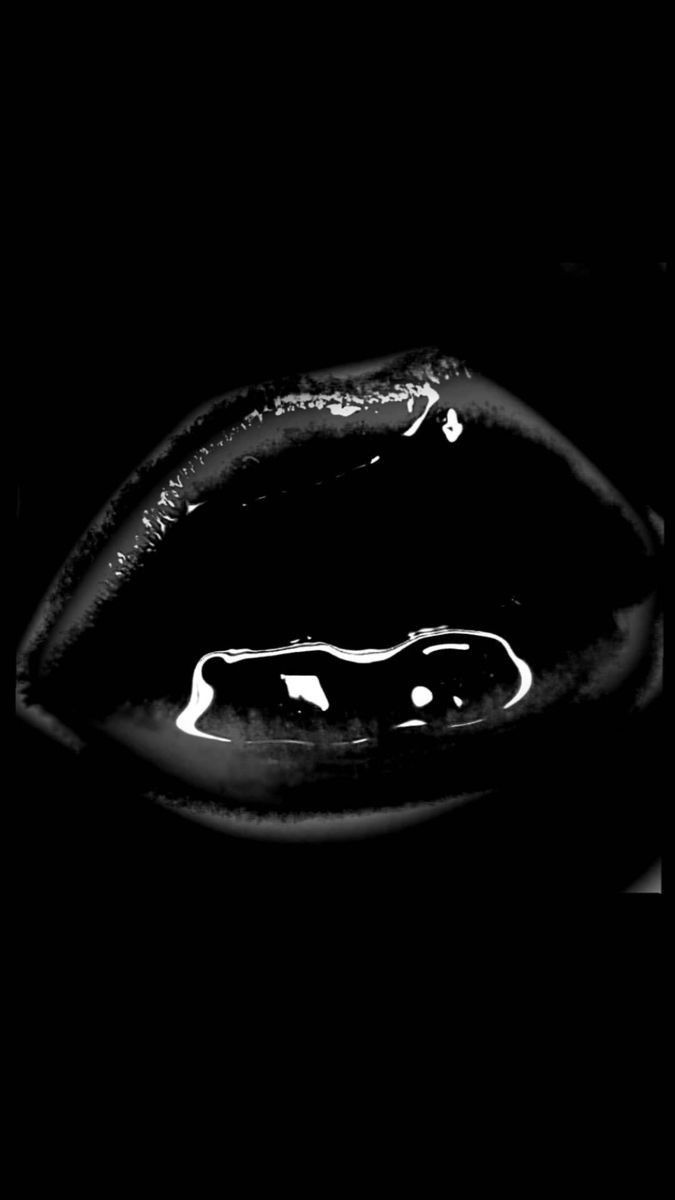 a black and white photo of a person's lips