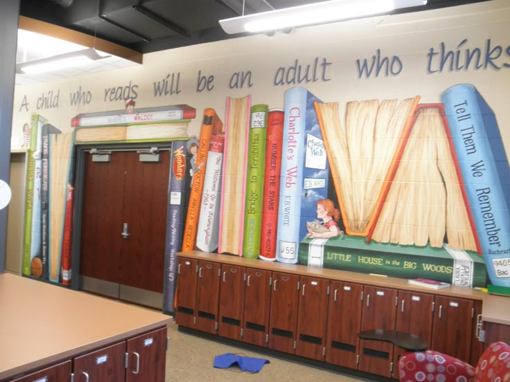 an office with bookshelves and a mural on the wall