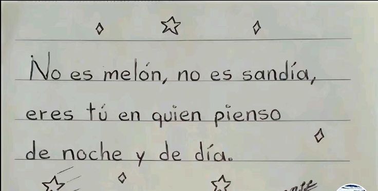 a handwritten poem written in spanish on a piece of paper with writing underneath it