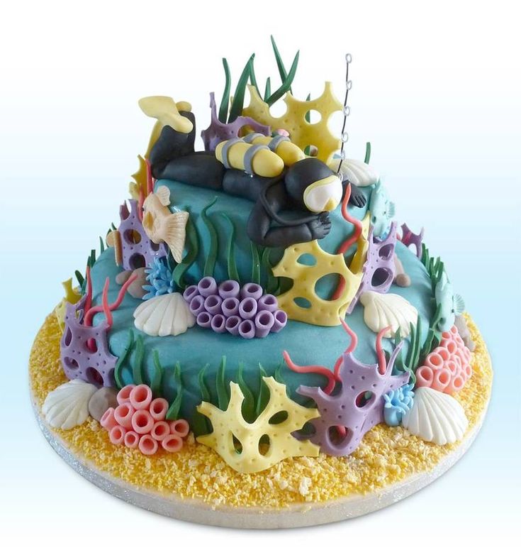 there is a cake decorated with sea animals and corals