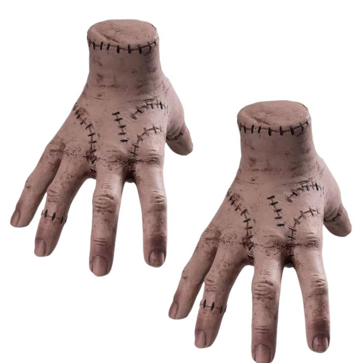 two hands that have been made to look like they are wearing gloves with stitches on them