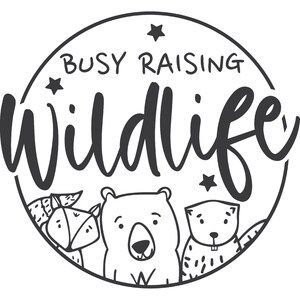 the logo for busy raising wildlife, with two bears and stars in the middle of it