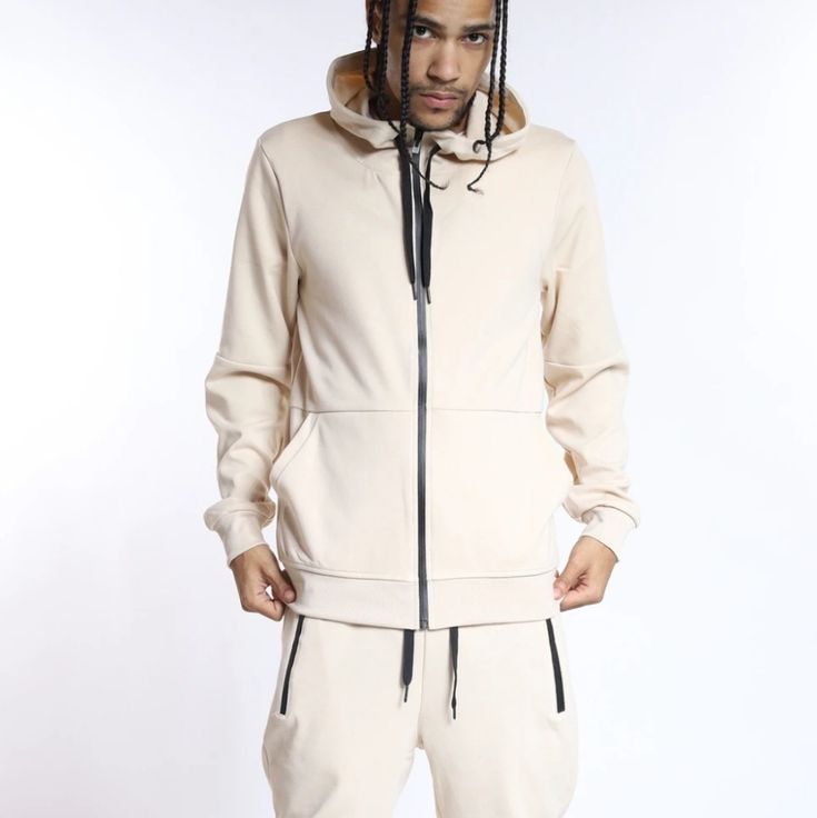 Our New Tech Fleece Hoodie And Jogger Set In Sand Color. These Comfy Stylish Jogger Set Are Perfect For Everyday And Casual Styling. Drawstring Closure Elasticated Waistband & Amkle Zip Up Pockets 55% Cotton 40% Polyester 5% Spandex Model Is 5'10 & Wear M/32 Winter Fleece Tracksuit In Athleisure Style, Fleece Athleisure Tracksuit For Fall, Fleece Tracksuit For Fall In Athleisure Style, Athleisure Fleece Tracksuit For Fall, Athleisure Hooded Jacket With Pockets For Loungewear, Sporty Beige Hoodie With Pockets, Hooded Fleece Tracksuit For Fall, Sporty Fleece Outerwear For Leisure, Fall Fleece Hoodie Tracksuit