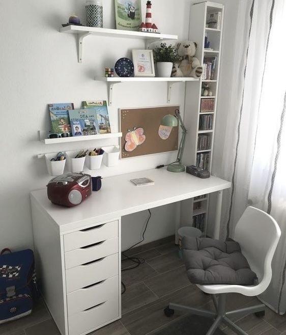 a white desk and chair in a room