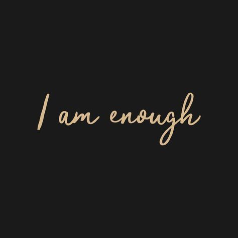 the words i am enough written in gold ink