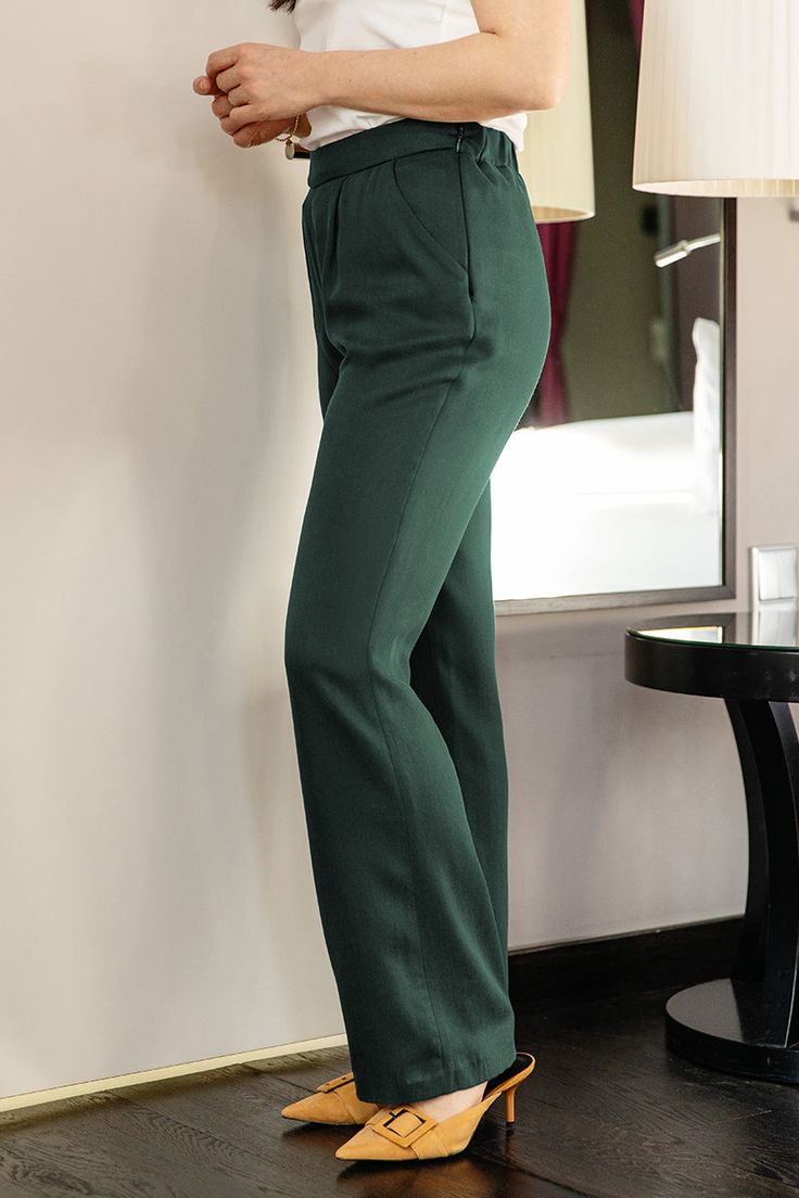 - Cloth trousers with a slightly flared leg
- Side zip closure
- Side pockets
- Classic pleats
- Comfortable fit thanks to the elastic waistband at the back
- Available in 3 lengths: S Petite 69cm, S Regular 75cm, S Long 81cm
- The model is 1.68 m tall and is wearing a size S. M length Regular
- Soft flowing, breathable fabric
- 100% TENCEL™ Lyocell (100 by OEKOTEX®) 
- Gentle cycle 30°C
- Made in Germany: The style is sewn for you
- Material origin: Turkey / beige: Italy
- Delivery time: 12 days Stretch Wide Leg Full-length Pants With Welt Pockets, Green Business Casual Full-length Pants, Green Full-length Pants For Business Casual, Tailored Full-length Green Bottoms, Classic Green Stretch Bottoms, Ladies Trousers, Pants Model, Classic Trousers, Dry Cleaners