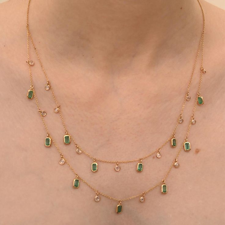 Accessorize your look with this elegant emerald beaded necklace. This stunning piece of jewelry instantly elevates a casual look or dressy outfit. Comfortable and easy to wear, it is just as exquisite worn alone or layered with other charms for a modern fashion statement.PRODUCT DETAILS :- Material - 18K Solid Yellow Gold Gemstone - Emerald Stone Weight - 2.9 ct Stone Pcs - 11 Diamond Weight - 1.29 ct Diamond pcs- 15 Stone Shape - Octagon Stone Size - 6 x 4 mm Length - 21 Inch Width - 4.7 mm Gro Gold And Gemstone Jewelry, Gold Necklace Designs Indian, Gold And Emerald Jewelry, Beeds Chain Designs, Elegant Necklaces Classy, Chain Designs Gold, Layered Necklaces Gold, Simple Diamond Necklace, Emerald And Diamond Necklace