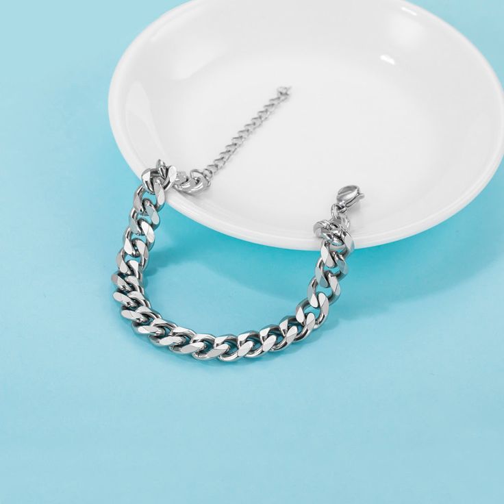 Make your regular outfit look fancier. The right piece of jewelry can add zest to any outfit. A silver-tone chain bracelet is a classic attachment suitable for both women and men.. Product details. General characteristics. The bracelet is made of stainless steel. It is 7.5+2 in. long and 0.3 in. wide. A six-side grinding chain is connected with the lobster buckle of 0.3 in.. Care tips. Good news for you: stainless steel jewelry doesn’t get corroded or rusted. So, feel free to wear this bracelet Everyday Bracelet, Pearl Hair Clip, Silver Chain Bracelet, Resin Necklace, Lovely Jewellery, Steel Jewelry, Stainless Steel Jewelry, Steel Chain, Stainless Steel Chain