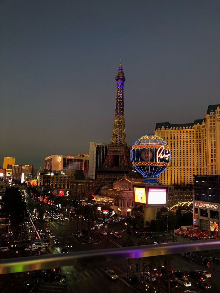 the eiffel tower is lit up at night in las vegas, nv