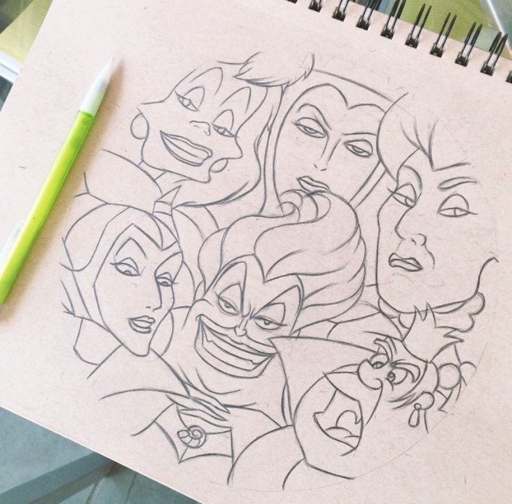 a drawing of disney characters on a piece of paper next to a green marker pen