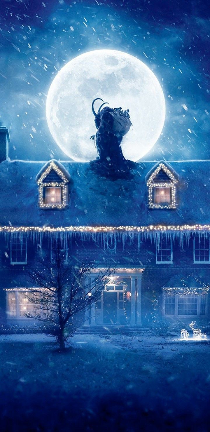 a house with snow falling on it and a person standing in front of the house