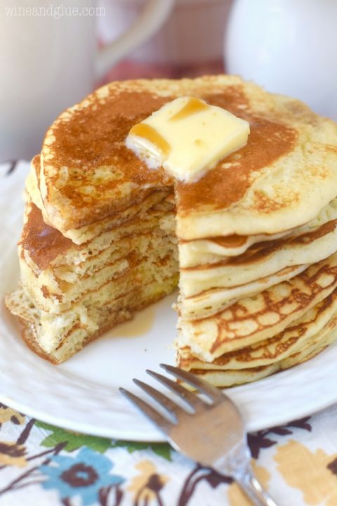 a stack of pancakes with butter on top