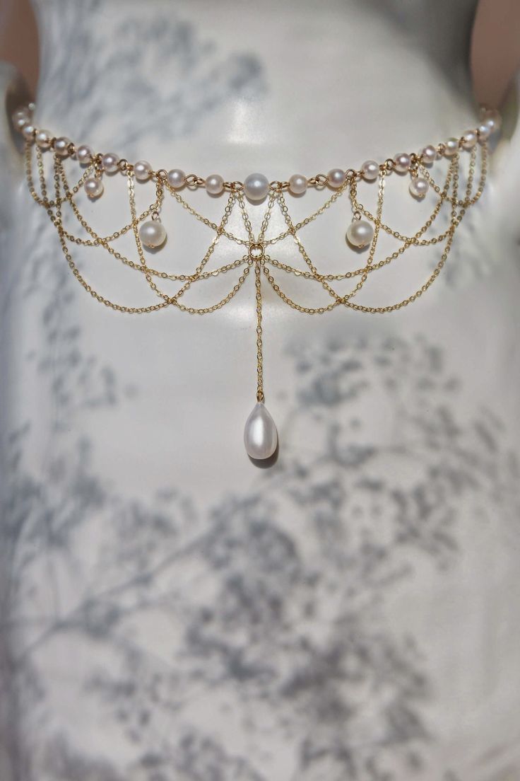 The Diane Pearl Necklace is intricately handcrafted with 14k gold-filled chain and freshwater pearls dangling elegantly from a strand of scintillating connected freshwater pearls. Preorder 7-10 days send out. 40cm/16 inches in length. Packaged in an elegant plastic-free reusable jewelry box, this necklace makes the perfect gift or special treat for oneself. Note: This very intricate necklace can tangle even with our utmost care in sending, please be gentle and patient to untangle and place in th Diy Freshwater Pearl Necklace, Shoulder Necklace Wedding, Pearl Star Necklace, Waistband Jewellery, Modern Jewelry Design Necklace, Wedding Necklaces For Bride, Pearl Jewelry Aesthetic, Pearl Shoulder Jewelry, Fantasy Jewelry Necklace