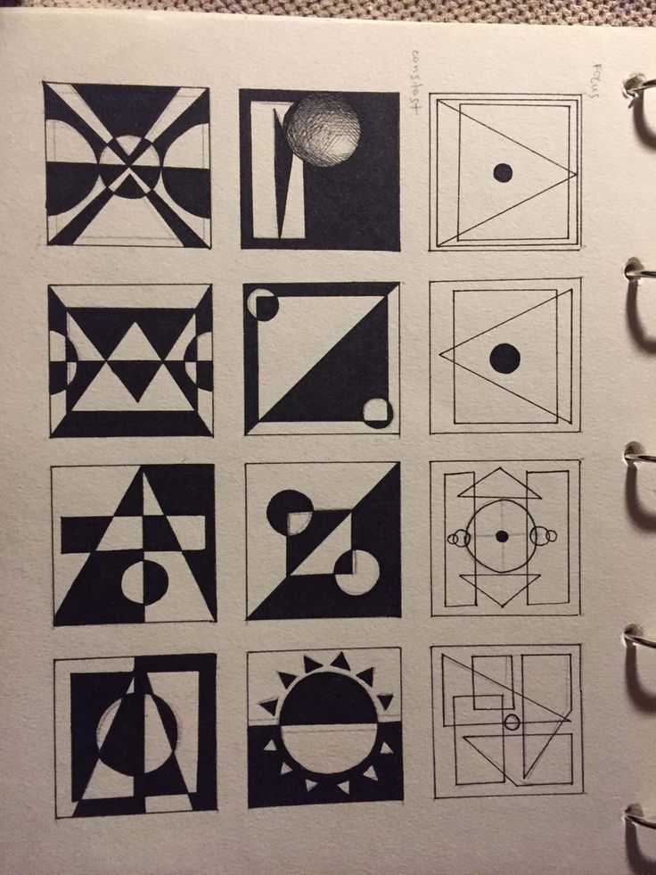 an open notebook with black and white drawings on it's pages, including geometric shapes