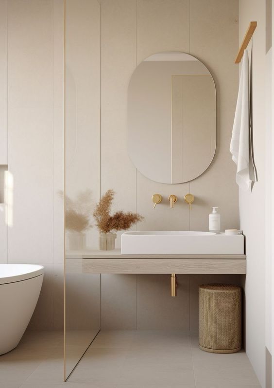 a bathroom with a sink, mirror and bathtub next to a wall mounted toilet