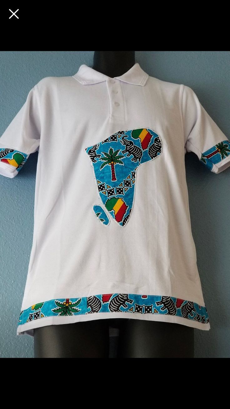 - Comfortable soft cotton polo collared shirt  - 100% African wax print Appliqué on front center and sleeves  - Classic & Fitted  Care Instructions:  Machine wash cold with mild detergent. Do not bleach. Hang to dry, Iron if needed. *Model wearing size Large*  Sizes available: Small, Medium, Large, Extra Large White Cotton Polo Shirt With Polo Collar, White Cotton Collared Polo Shirt, Summer Cotton Polo Shirt With Graphic Print, Summer Graphic Print Cotton Polo Shirt, Blue Cotton Collared Shirt, Blue Cotton Shirt With Collared Neckline, Cotton Polo Shirt With Graphic Print, Cotton Collared T-shirt With Graphic Print, Multicolor Long Sleeve Cotton Polo Shirt