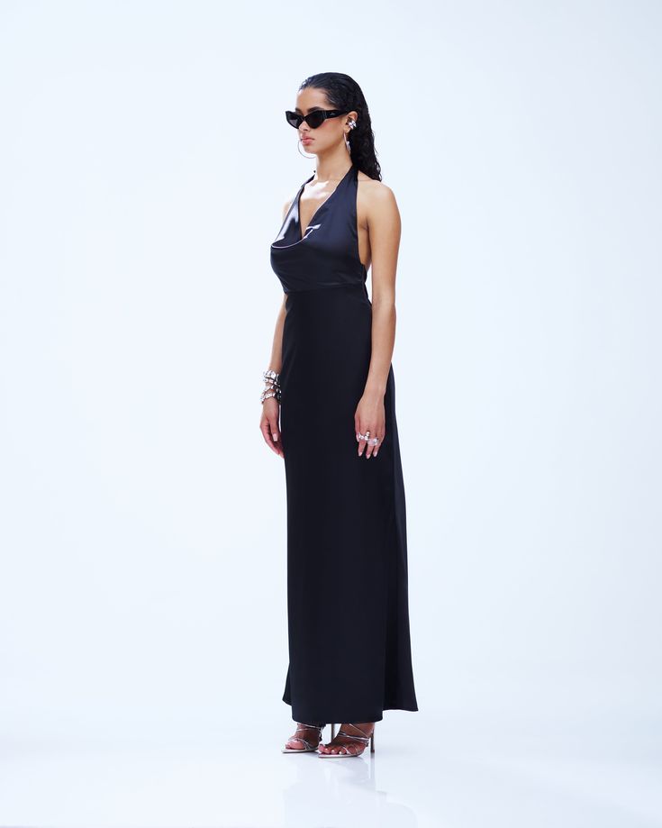 Slip into seduction with this black maxi dress 🖤 Made from luxurious satin charmeuse fabric, this piece is complete with a bias cut and a cowl neck for a look that gives off a chic and mysterious vibe that will have everyone hooked 😌 Fitted Bias Cut Satin Maxi Dress, Bias Cut Modal Satin Dress For Date Night, Satin Maxi Dress With Bias Cut For Date Night, Sleek Backless Maxi Dress, Bias Cut Satin Maxi Dress For Date Night, Maxi Length Satin Finish Slip Dress For Night Out, Maxi Length Satin Slip Dress For Night Out, Satin Finish Maxi Slip Dress For Night Out, Satin Finish Maxi Length Slip Dress For Night Out