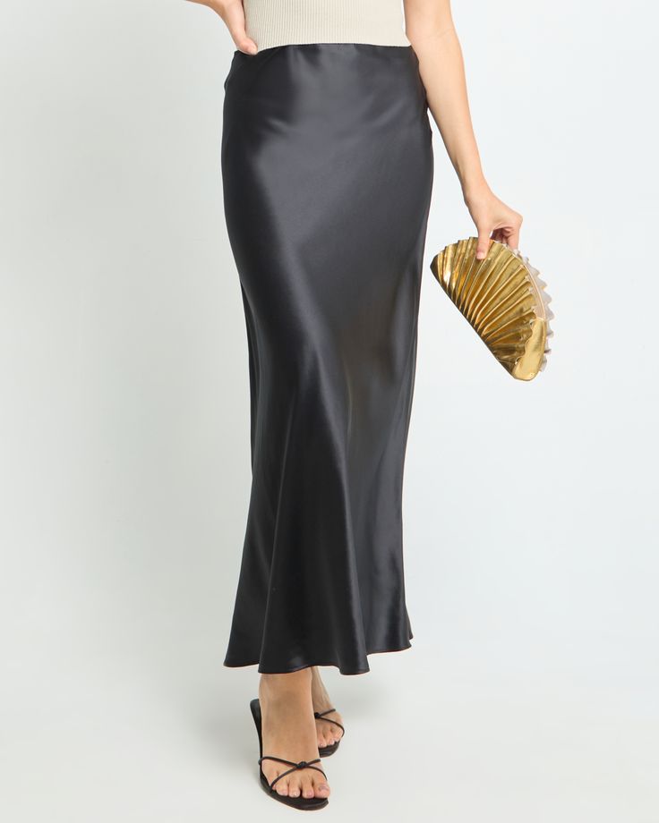 Silk Wrap Skirt Black, Luxury Black A-line Maxi Skirt, Luxury Satin Finish Maxi Skirt, Luxury Black Maxi Skirt, Luxury Silk Bias Cut Skirt, Luxury Silk Relaxed Maxi Skirt, Luxury Silk Flowy Skirt, Luxury Silk Maxi Skirt For Wedding, Luxury Black Relaxed Fit Maxi Skirt