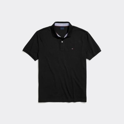 Men's Custom Fit Polo  Deep Black  - Tommy Hilfiger men’s polo. What we do best—our iconic polo  spun from pure cotton in a custom fit that looks and feels as if it was made for you. Part of our Adaptive Collection  designed for ease of dressing in classic Tommy style. Classic Solid Polo Shirt For Golf, Classic Polo Shirt For Golf, Classic Black Polo Shirt For Golf, Classic Collared Golf T-shirt, Classic Black Tommy Hilfiger Top, Classic Tommy Hilfiger Collared Polo Shirt, Classic Tommy Hilfiger Cotton Polo Shirt, Classic Tommy Hilfiger Collared Tops, Tommy Hilfiger Store